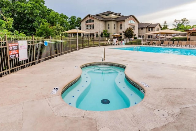 123 Bunker Ridge Dr Unit 4, Branson, MO 65616 - community pool featuring a patio area
