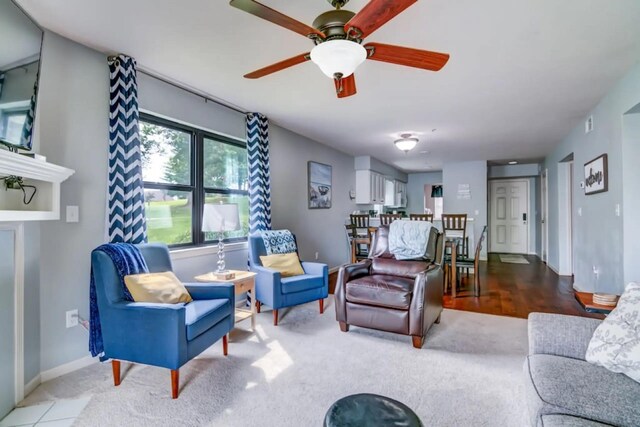 123 Bunker Ridge Dr Unit 4, Branson, MO 65616 - carpeted living area featuring a ceiling fan and baseboards