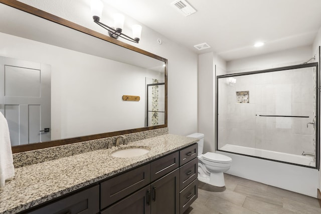 full bathroom with vanity, toilet, enclosed tub / shower combo, and recessed lighting