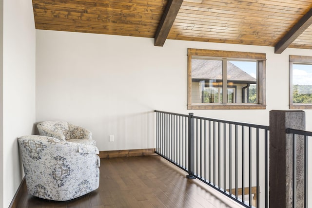 sitting room featuring wooden ceiling, wood-type flooring, and baseboards