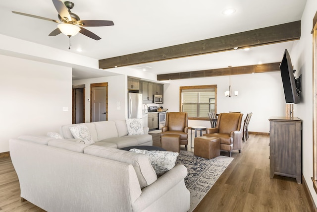 living room featuring a ceiling fan, beam ceiling, wood finished floors, recessed lighting, and baseboards