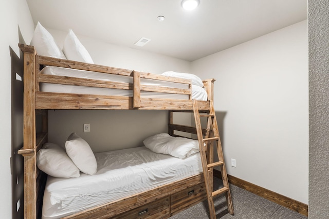 bedroom with carpet flooring and baseboards