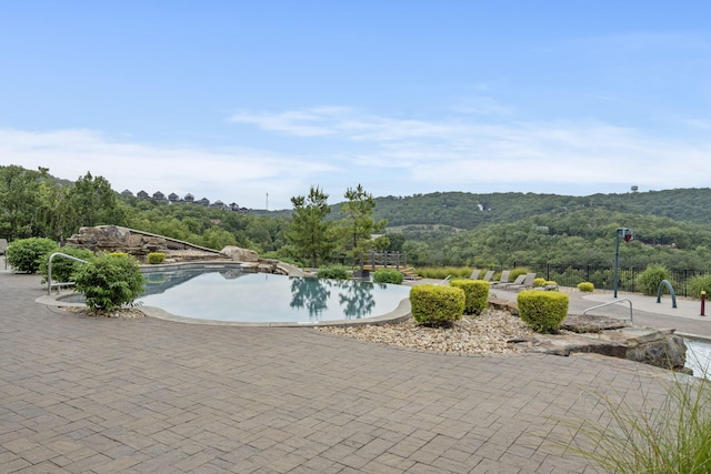 water view featuring a forest