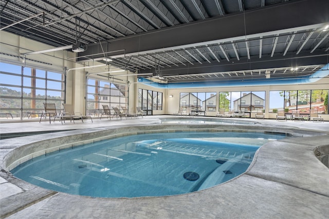 indoor community pool with a patio