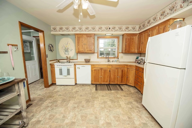 202 E Seminole St, Springfield, MO 65807 - kitchen featuring white appliances, a sink, a ceiling fan, light countertops, and stone finish floors