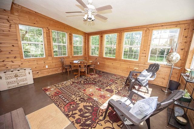 202 E Seminole St, Springfield, MO 65807 - sunroom / solarium featuring vaulted ceiling, wood walls, and concrete floors