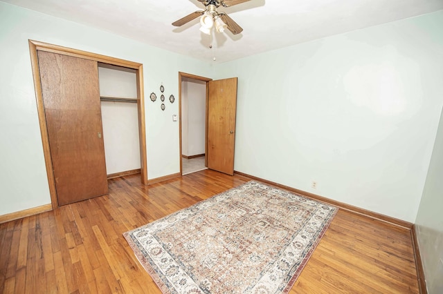 202 E Seminole St, Springfield, MO 65807 - unfurnished bedroom featuring light wood-style flooring, a closet, baseboards, and a ceiling fan