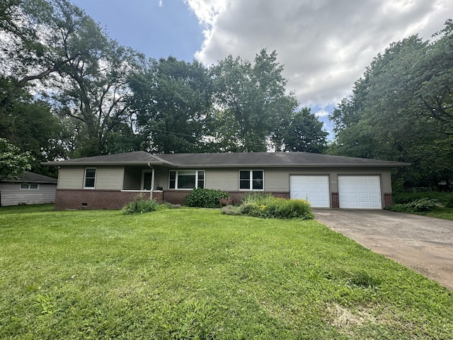 202 E Seminole St, Springfield, MO 65807 - ranch-style house featuring a garage, driveway, brick siding, and a front yard