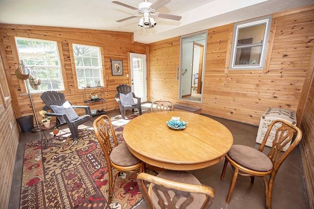 202 E Seminole St, Springfield, MO 65807 - dining space with wooden walls, healthy amount of natural light, and a ceiling fan