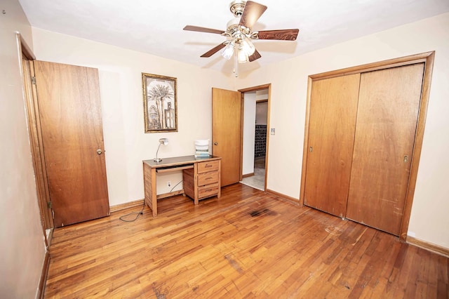 202 E Seminole St, Springfield, MO 65807 - bedroom with light wood-style floors, a closet, baseboards, and ceiling fan