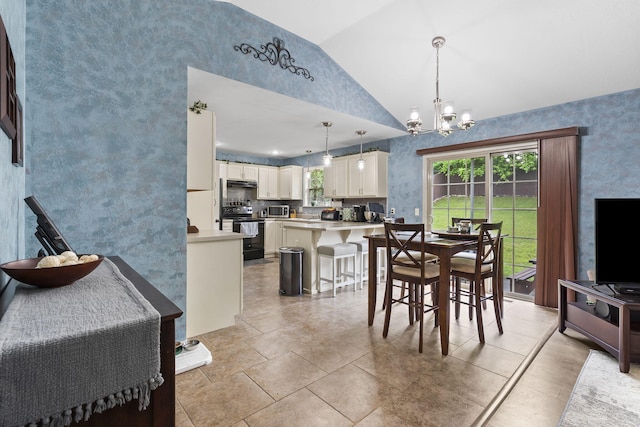 1206 S Solaira St, Ozark, MO 65721 - dining area featuring vaulted ceiling, a chandelier, and wallpapered walls