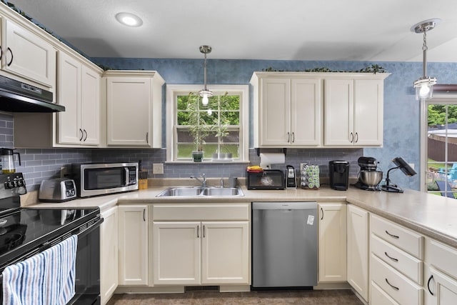 1206 S Solaira St, Ozark, MO 65721 - kitchen featuring stainless steel appliances, a sink, under cabinet range hood, and backsplash