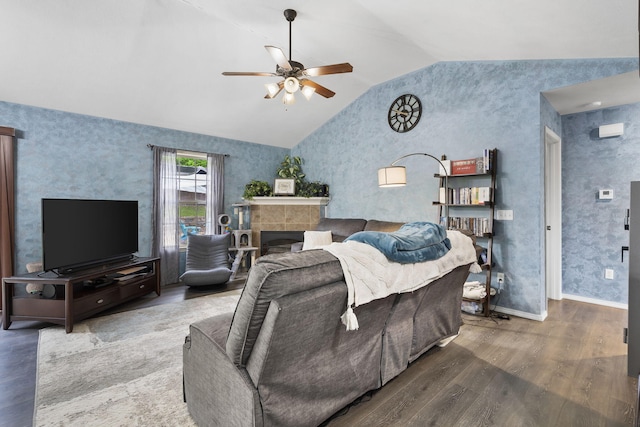 1206 S Solaira St, Ozark, MO 65721 - living room featuring lofted ceiling, wood finished floors, a ceiling fan, a tiled fireplace, and baseboards