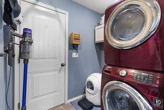 1206 S Solaira St, Ozark, MO 65721 - washroom featuring stacked washer / drying machine and baseboards