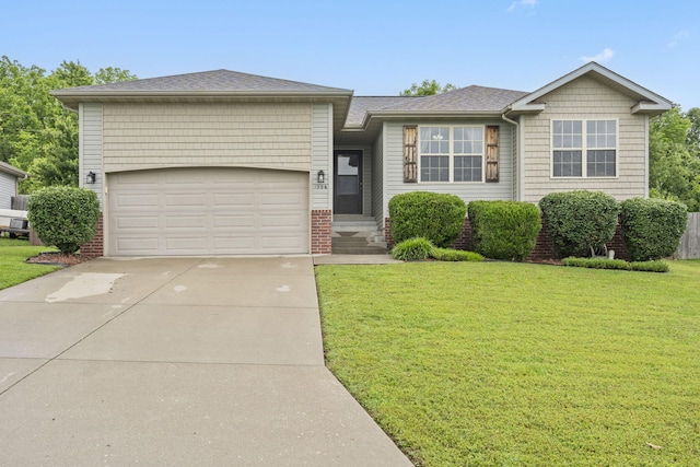 1206 S Solaira St, Ozark, MO 65721 - view of front facade with a front lawn, concrete driveway, a garage, and a shingled roof