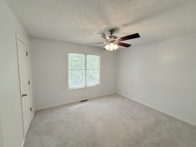 5135 S Clay Ave, Springfield, MO 65810 - unfurnished room with a ceiling fan, a textured ceiling, baseboards, and light carpet