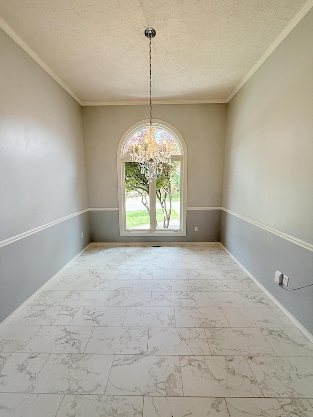 5135 S Clay Ave, Springfield, MO 65810 - empty room with marble finish flooring, a chandelier, baseboards, a textured ceiling, and ornamental molding