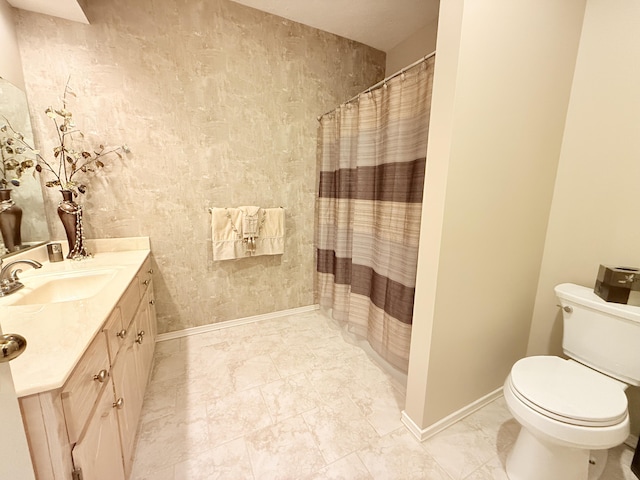 5135 S Clay Ave, Springfield, MO 65810 - full bathroom with vanity, toilet, marble look tiles, a shower with curtain, and baseboards