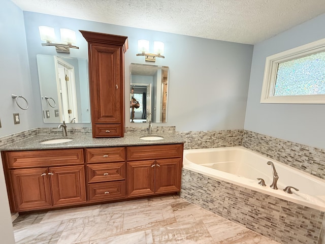 5135 S Clay Ave, Springfield, MO 65810 - full bath featuring a bath, double vanity, and a textured ceiling