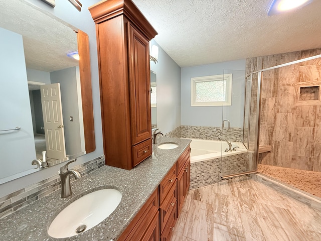 5135 S Clay Ave, Springfield, MO 65810 - full bath featuring a textured ceiling, a garden tub, a shower stall, and double vanity