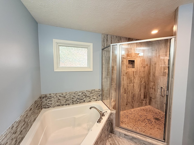 5135 S Clay Ave, Springfield, MO 65810 - full bathroom with a garden tub, a stall shower, and a textured ceiling
