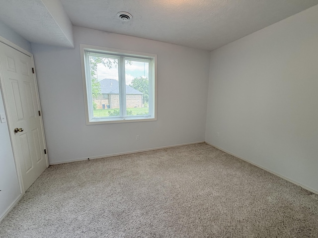 5135 S Clay Ave, Springfield, MO 65810 - empty room with carpet floors, baseboards, and a textured ceiling