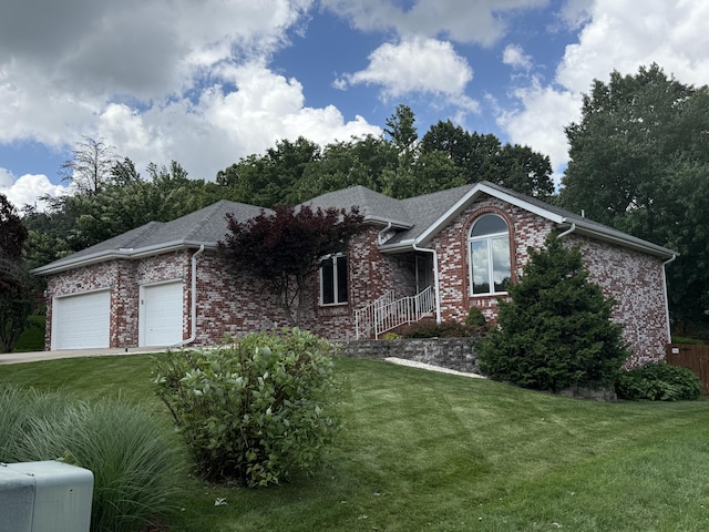 5135 S Clay Ave, Springfield, MO 65810 - ranch-style house featuring a garage, brick siding, and a front lawn