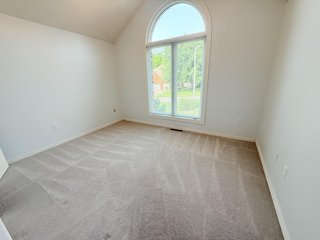 5135 S Clay Ave, Springfield, MO 65810 - empty room featuring vaulted ceiling, carpet, and baseboards