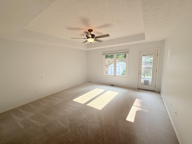 5135 S Clay Ave, Springfield, MO 65810 - unfurnished room with a tray ceiling, light colored carpet, a textured ceiling, ceiling fan, and baseboards