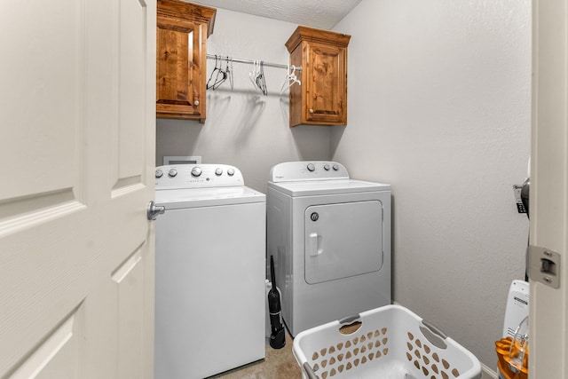1054 Thoroughfare St, Seymour, MO 65746 - laundry area featuring separate washer and dryer and cabinet space