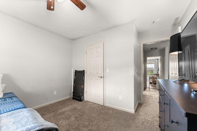1054 Thoroughfare St, Seymour, MO 65746 - bedroom with baseboards, light carpet, and a ceiling fan