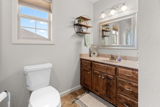 1054 Thoroughfare St, Seymour, MO 65746 - bathroom featuring toilet, vanity, and baseboards