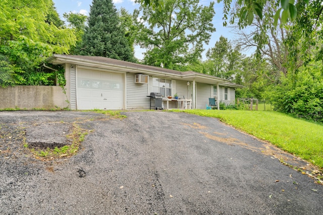1408 Rockhill Cir, Ozark, MO 65721 - single story home with a garage, driveway, and a wall mounted AC