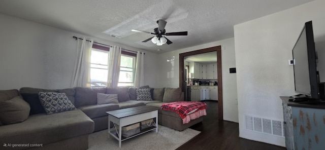 414 3rd St, Anderson, MO 64831 - living room with ceiling fan, wood finished floors, and a textured ceiling