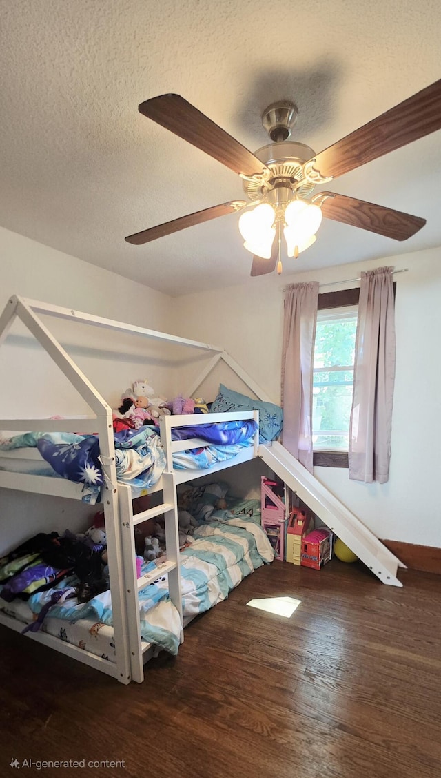 414 3rd St, Anderson, MO 64831 - bedroom featuring wood finished floors, a ceiling fan, and a textured ceiling