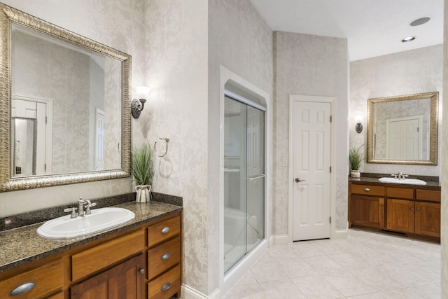 2421 Candlebark Ln, Lebanon, MO 65536 - full bathroom with a shower stall, two vanities, and tile patterned floors