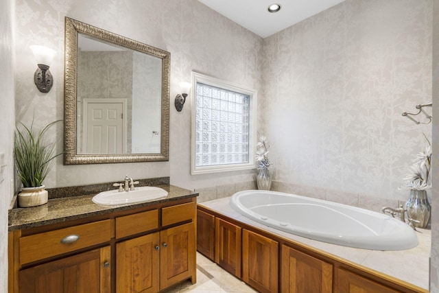 2421 Candlebark Ln, Lebanon, MO 65536 - bathroom featuring a garden tub and vanity