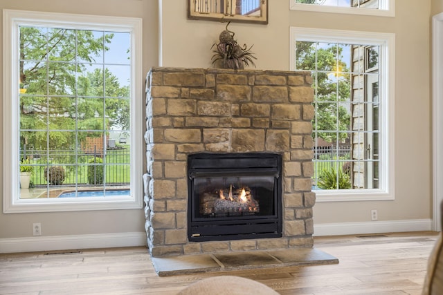 2421 Candlebark Ln, Lebanon, MO 65536 - detailed view of wood finished floors and a fireplace