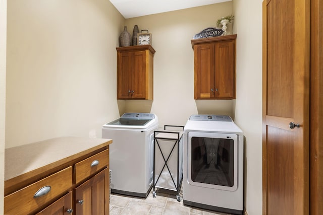 2421 Candlebark Ln, Lebanon, MO 65536 - laundry room featuring washing machine and dryer and cabinet space