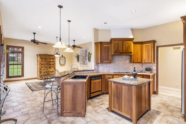 2421 Candlebark Ln, Lebanon, MO 65536 - kitchen featuring paneled dishwasher, ceiling fan, brown cabinetry, light stone finish floors, and recessed lighting