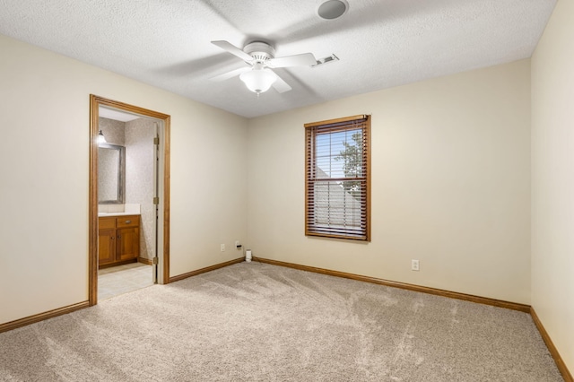 2421 Candlebark Ln, Lebanon, MO 65536 - spare room with light carpet, a ceiling fan, and a textured ceiling