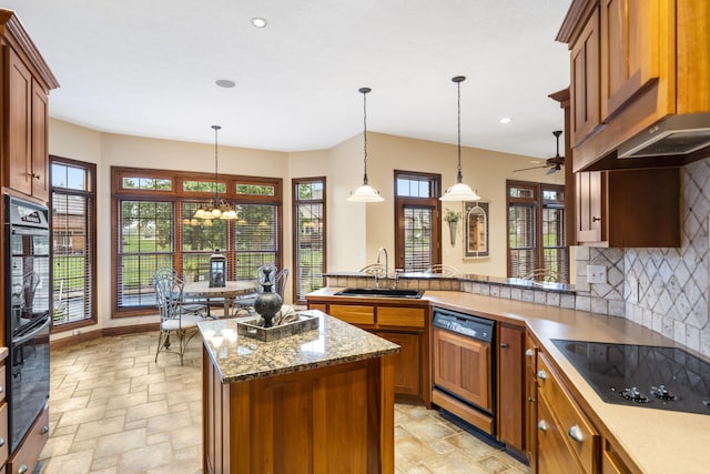 2421 Candlebark Ln, Lebanon, MO 65536 - kitchen with black appliances, stone tile floors, healthy amount of natural light, and recessed lighting
