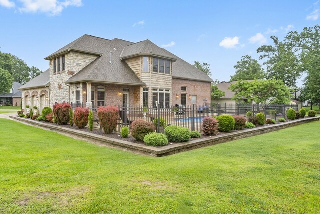 2421 Candlebark Ln, Lebanon, MO 65536 - rear view of house featuring stone siding and a patio
