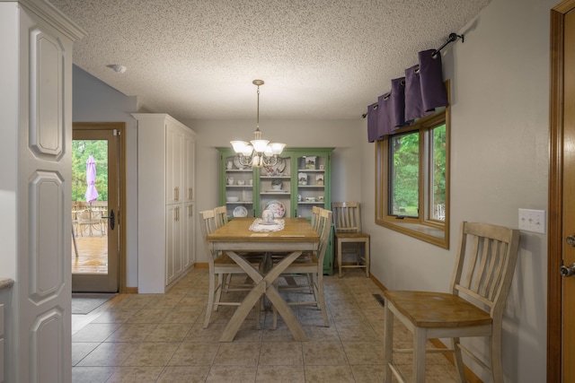 10703 Lawrence Unit 2230, Monett, MO 65708 - dining area with a chandelier, a textured ceiling, and light tile patterned flooring