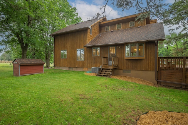 10703 Lawrence Unit 2230, Monett, MO 65708 - rear view of house with a yard, a shingled roof, central air condition unit, and a deck