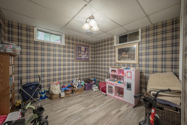 10703 Lawrence Unit 2230, Monett, MO 65708 - game room featuring wallpapered walls, a paneled ceiling, and wood finished floors