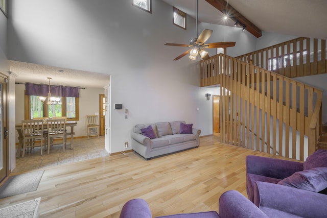 10703 Lawrence Unit 2230, Monett, MO 65708 - living area featuring wood finished floors, a chandelier, beamed ceiling, high vaulted ceiling, and ceiling fan