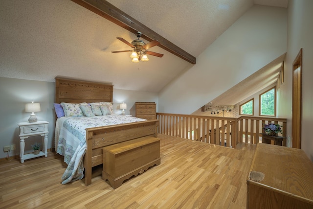 10703 Lawrence Unit 2230, Monett, MO 65708 - bedroom with wood finished floors, beamed ceiling, high vaulted ceiling, and a textured ceiling