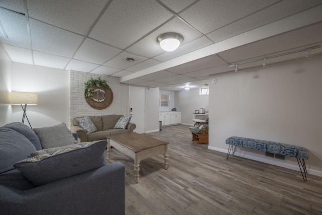 10703 Lawrence Unit 2230, Monett, MO 65708 - living area with wood finished floors, baseboards, and a drop ceiling