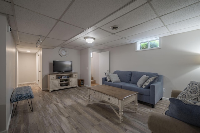 10703 Lawrence Unit 2230, Monett, MO 65708 - living area with a drop ceiling, wood finished floors, and baseboards